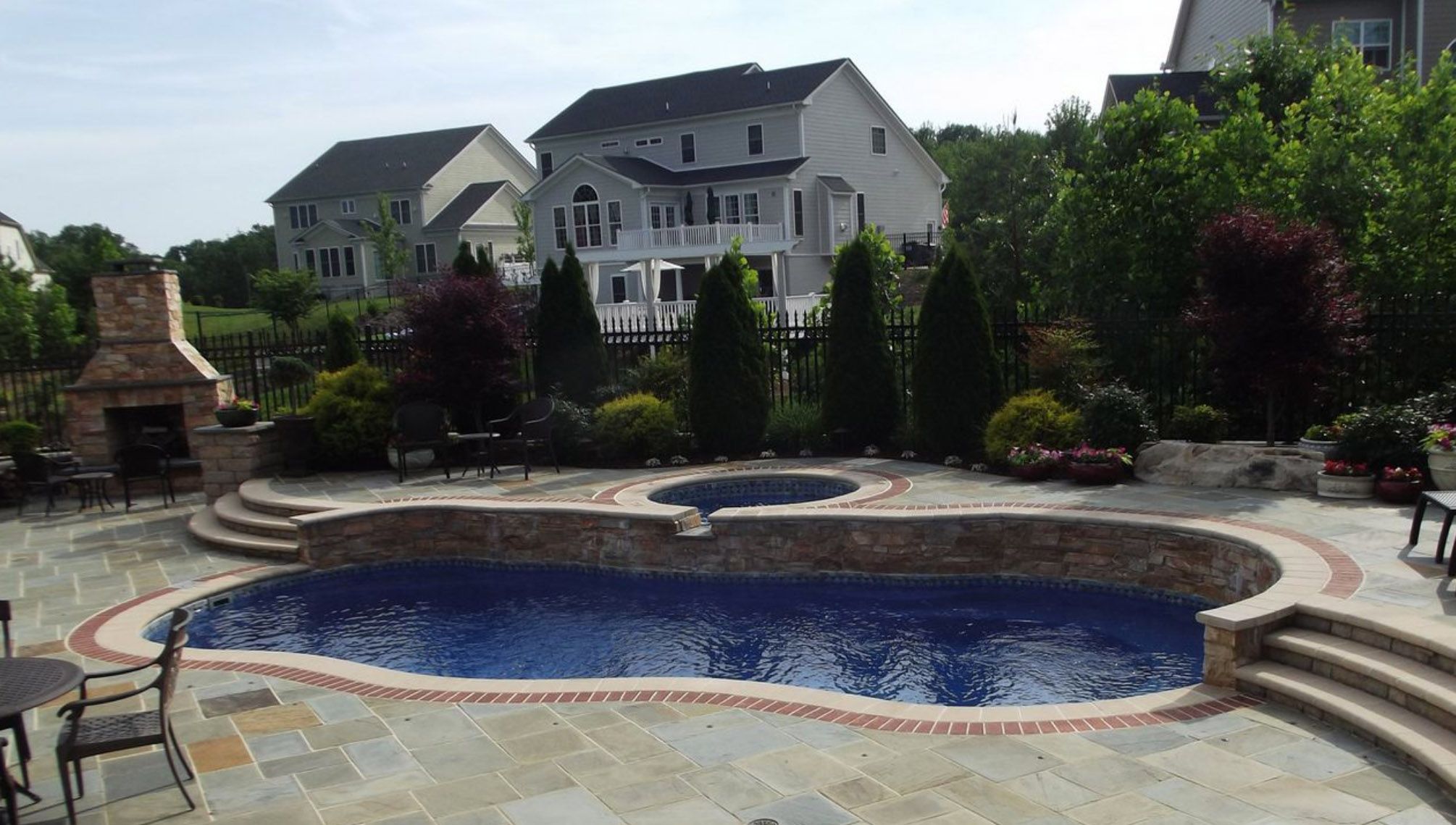 fiberglass pool with retaining wall